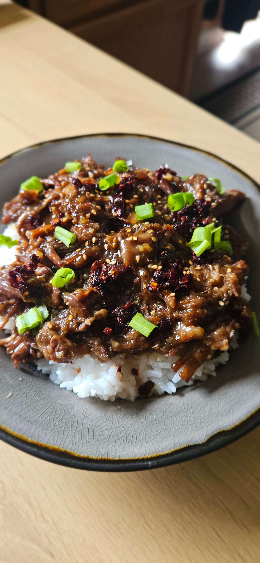 Image of honey ginger birria, a savory sweet and tangy recipe that uses left over birria meat from the previous day. This combines the intense boldness of birria tacos with southern Asian flavors creating a unique yet delightful dish.
