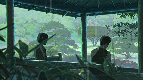 A gif of two people sitting in the rain not looking at each other. The background has a green, sort of comforting feeling, just as comforting as the rain itself.